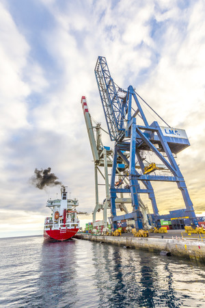 ARRECIFE, SPAIN - NOV 11, 2014: SPICA from Hamburg anchors in the new harbor of Arrecife, Spain.  SPICA Hamburg is a german  Containerfeeder with 700 TEU-storage capacity.のeditorial素材