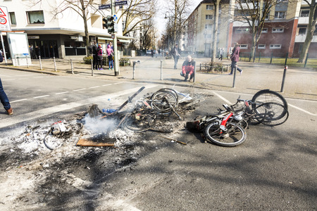 FRANKFURT, GERMANY - MAR 18, 2015: people demonstrate against EZB and Capitalism in Frankfurt, Germany. Some people destroy windows and objects at the street are burning.のeditorial素材