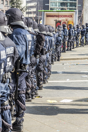 FRANKFURT, GERMANY - MAR 18, 2015: people demonstrate against EZB and Capitalism in Frankfurt, Germany. 9 tsd policemen guard the demo.のeditorial素材