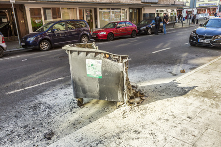 FRANKFURT, GERMANY - MAR 18, 2015: people demonstrate against EZB and Capitalism in Frankfurt, Germany. Some people destroy windows and objects at the street are burning.のeditorial素材
