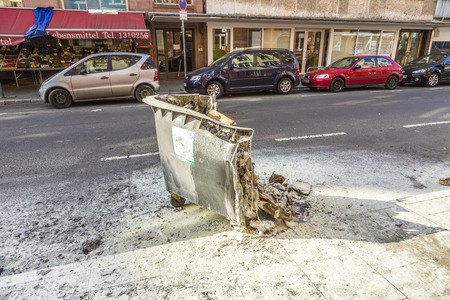 FRANKFURT, GERMANY - MAR 18, 2015: people demonstrate against EZB and Capitalism in Frankfurt, Germany. Some people destroy windows and objects at the street are burning.のeditorial素材