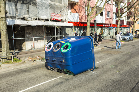 FRANKFURT, GERMANY - MAR 18, 2015: people demonstrate against EZB and Capitalism in Frankfurt, Germany. Some people destroy windows and objects at the street are burning.のeditorial素材