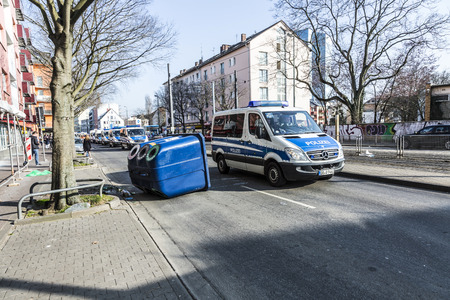 FRANKFURT, GERMANY - MAR 18, 2015: people demonstrate against EZB and Capitalism in Frankfurt, Germany. Some people destroy windows and objects at the street are burning.のeditorial素材