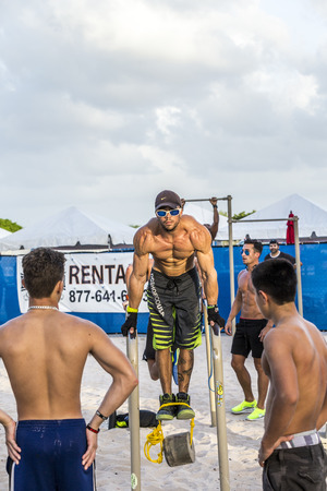 MIAMI, USA - AUG 30, 2014: bodybuilder train at  south beach in Miami, USA. The free fitness area is...