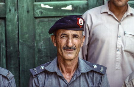 PESHAWAR, PAKISTAN - JUNE 30, 1987: portrait of proud elderly policeman in Peshawar, Pakistan. He likes to pose for tourists and tells proudly about the british history.のeditorial素材