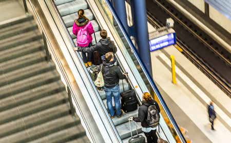 BERLIN, GERMANY - NOV 27, 2014: People inside the Berlin Central train station in Berlin, Germany. It is the is the main railway station in Berlin with a surface area of 85x120 mt.のeditorial素材