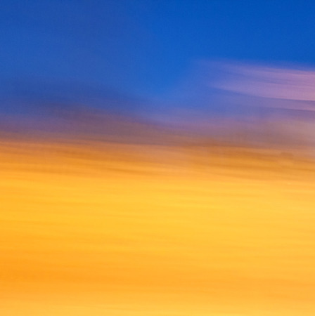 blue and golden sunset gives a harmonic backgroudの写真素材