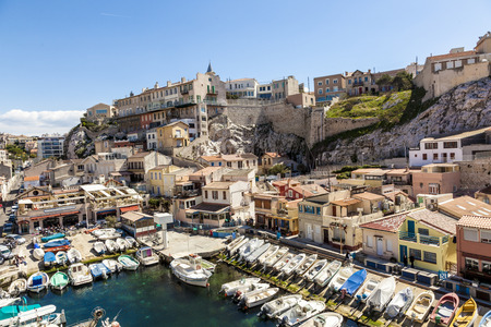 MARSEILLE, FRANCE - APR 6, 2015 : Fishemen boats in a small harbor. The Vallon des Auffes is a small fishing port of the 7eme district of Marseille, France.のeditorial素材