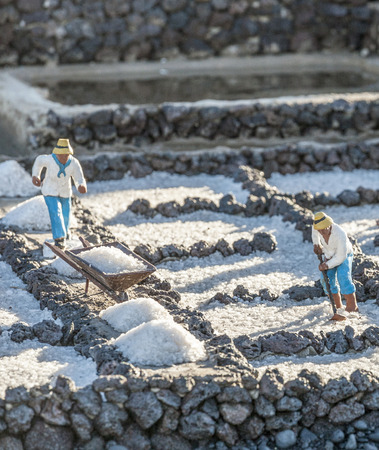 YAIZA, SPAIN - DEC 23, 2010: christmas crip at the public place in Yaiza, Spain. The scene shows worker in the saline de Janubio in Lanzarote integrated in christian native scene.のeditorial素材