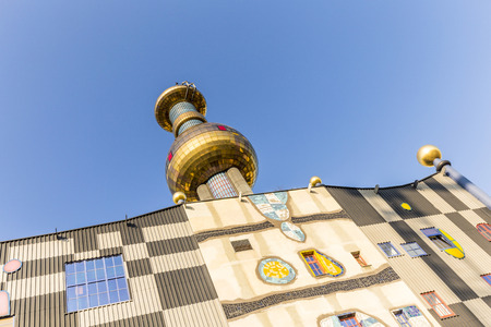 VIENNA, AUSTRIA - APR 24, 2015: The District heating plant in Vienna, Austria.  Designed by the famous Austrian artist and architect Friedensreich Hundertwasser. It was inaugurated in 1992.のeditorial素材