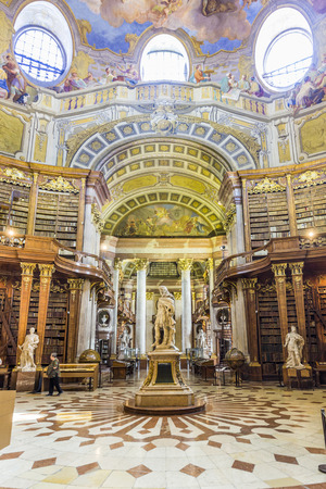 VIENNA, AUSTRIA - APR 24, 2015:  books in the beautiful Austrian National Library in Vienna, Austria. Est in 18th century, the largest library in Austria with 7.4 mill items.のeditorial素材