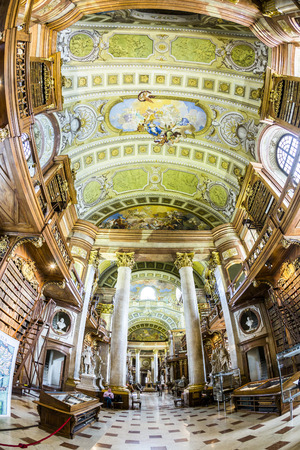 VIENNA, AUSTRIA - APR 24, 2015:  books in the beautiful Austrian National Library in Vienna, Austria. Est in 18th century, the largest library in Austria with 7.4 mill items.のeditorial素材
