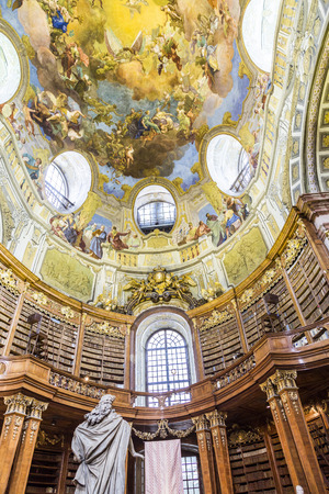 VIENNA, AUSTRIA - APR 24, 2015:  books in the beautiful Austrian National Library in Vienna, Austria. Est in 18th century, the largest library in Austria with 7.4 mill items.のeditorial素材