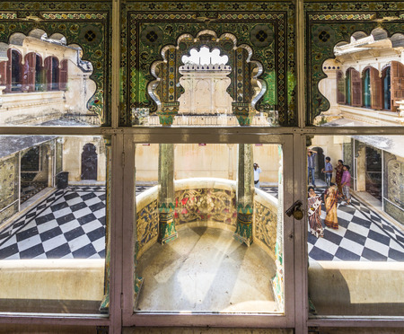 UDAIPUR, INDIA - OCT 21, 2012: local people visit the City Palace in Udaipur, India. The foundation of the fort was laid in 1559  by Udai Singh.のeditorial素材