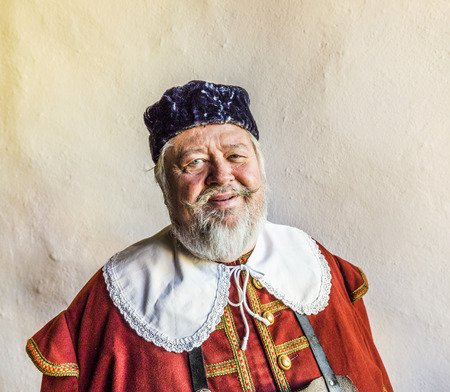 ROTHENBURG, GERMANY: old man dressed in medieval clothes in Rothenburg, Germany. Especially the japanese tourists enjoy tours guided by people in historic costumes.のeditorial素材