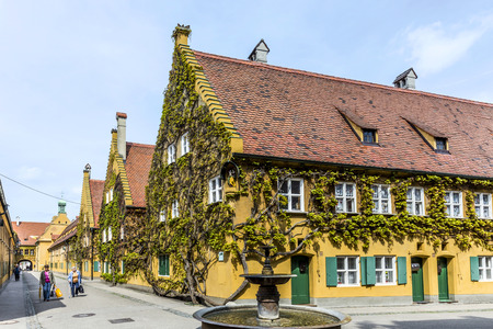 AUGSBURG, GERMANY - APRIL 29, 2015: The Fuggerei is the worlds oldest social housing complex still in use in Augsburg, Germany.のeditorial素材