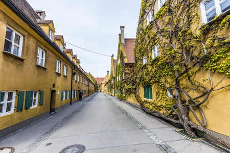 AUGSBURG, GERMANY - APRIL 29, 2015: The Fuggerei is the worlds oldest social housing complex still in use in Augsburg, Germany.のeditorial素材