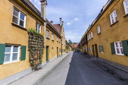 AUGSBURG, GERMANY - APRIL 29, 2015: The Fuggerei is the worlds oldest social housing complex still in use in Augsburg, Germany.のeditorial素材