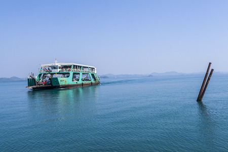 KOH CHANG, INDONESIA - JAN 7, 2008: ferry arrives at the island of Koh Chang, Indonesia. The ferry from Tha Thammachat operates 10 times a day and transports cars as well a sgoods for the hotels.のeditorial素材
