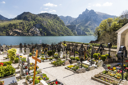 TRAUNKIRCHEN, AUSTRIA - APR 22, 2015: old cemetery at the church yard in Traunkichen, Austria. The abbey was already in existance by 632 A.D.のeditorial素材
