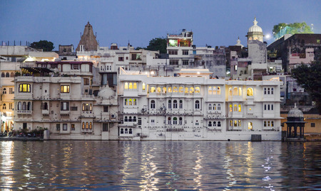 UDAIPUR, INDIA - OCT 21, 2012: View over lake Pichola at dusk in Udaipur, India. daipur is the historic capital of the kingdom of Mewar in the former Rajputana Agency.のeditorial素材