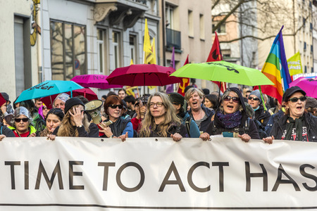 FRANKFURT, GERMANY - MAR 18, 2015: people demonstrate against EZB and Capitalism in Frankfurt, Germany. 30 tsd people demonstrate. They are holding banners.のeditorial素材
