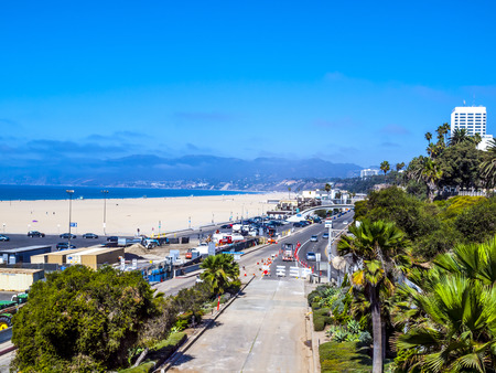 LOS ANGELES, USA - SEP 23, 2014: Many people sunbath on the sand beach and swim in the ocean in Santa Monica Beach, Los Angeles, CA, USAのeditorial素材
