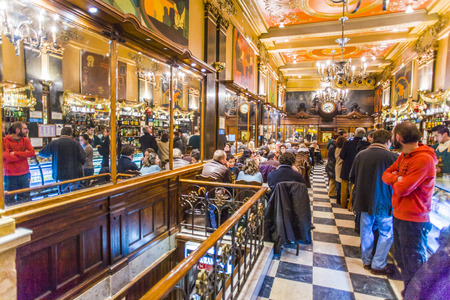 LISBON, PORTUGAL - DEC 27, 2008: people enjoy the Cafe A Brasileira in Lisbon, Portugal. The Cafe  is one of the oldest and most famous cafes in the old quarter of Lisbon.のeditorial素材