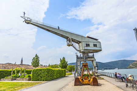BINGEN, GERMANY - MAY 24, 2015: old crane with iron man in Bingen, Mainz. Artist Hubertus von der Goeltz created that man  walking at crane in 2007.のeditorial素材
