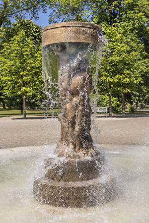 BAD NAUHEIM, GERMANY - JUNE 4, 2015: fountain Adam and eve in paradise in Bad Nauheim, Germany. Artist Richard Hess created the fountain in 1980.のeditorial素材