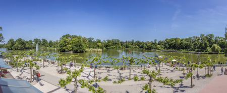 BAD NAUHEIM, GERMANY - JUNE 4, 2015: people enjoy the lake in Bad Nauheim, Germany. The area was created by architect Heinrich Siesmayer.のeditorial素材