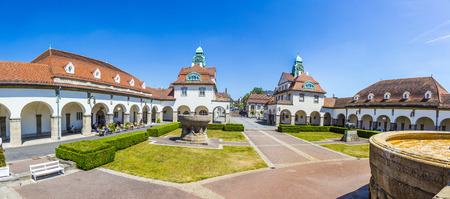 BAD NAUHEIM, GERMANY -JUNE 4, 2015: people enjoy the sun in the beautiful Sprudelhof in Bad Nauheim, Germany. The Sprudelhof was built in 1905.のeditorial素材