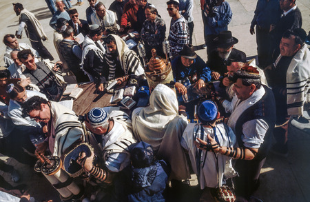JERUSALEM - JAN 1 1994: Orthodox jewish men pray at the Western Wall in Jerusalem, Israel. Israels annexation of East Jerusalem in 1967, including the Old City, was never internationally recognized.のeditorial素材
