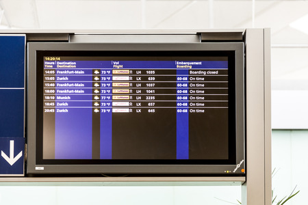 PARIS, FRANCE - JUNE 13, 2015: Charles de Gaulle  airport, hall of departures in Paris, France. A board with the schedule of departures of planes indicates latest infos.のeditorial素材