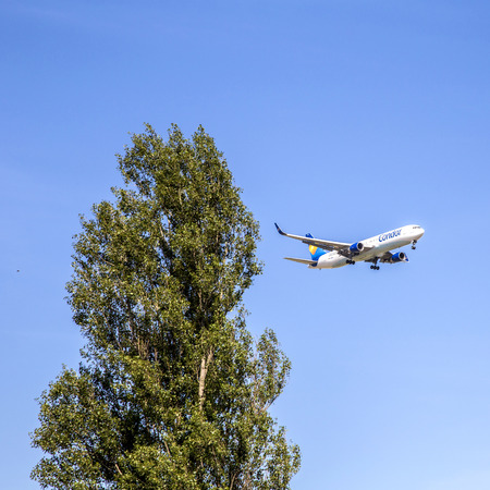 FRANKFURT, GERMANY - JUNE 17, 2015: condor aircraft D-ABUH in landing approach at Frankfurt Rhein Main Airport, Germany. In 2012, Frankfurt handled 57.5 million passengers.のeditorial素材
