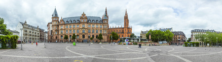 WIESBADEN, GERMANY - JUNE 21, 2015: Town hall Wiesbaden, in the background a steeple of the Marktkirche in Wiesbaden, Germany.のeditorial素材