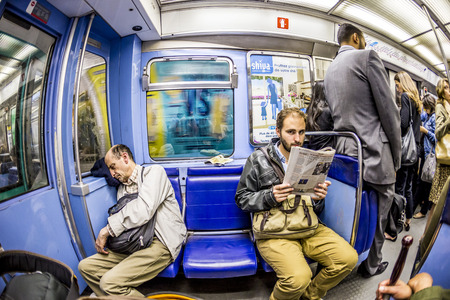 PARIS , FRANCE- JUNE 10, 2015: Tourists and locals on a subway train Line 8 in Paris, France. More than 30 million people visit Paris annually.のeditorial素材