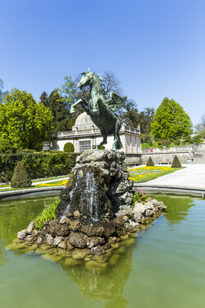 SALZBURG, AUSTRIA - APR 21, 2015:bronce horse statue in the fountain of the Mirabell Gardens in Salzburg, Austria. The Gardens were redesigned around 1690 by Johann Ernst Graf von Thun.のeditorial素材