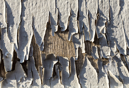 Damaged plaster concrete background wall in grey