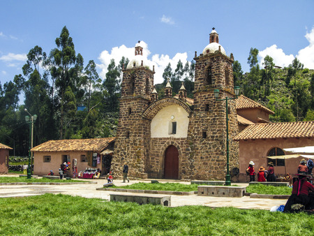 RAQCHI, PERU - JAN 19, 2015: people visit the church San Pedro de Cacha in Raqchi, Peru. The church of Raqchi is placed near the incan temple of Wiracocha.のeditorial素材