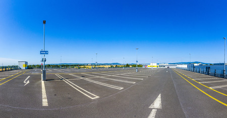 empty outdoors parking area under blue skyのeditorial素材