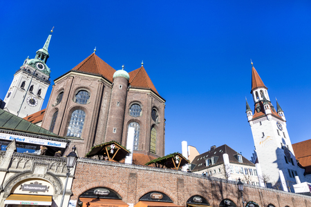 MUNICH, GERMANY -  DEC 24, 2014: Tourists at the Viktualienmarkt in Munich, Germany. Munich is the biggest city of Bavaria with almost 100 million visitors a year.のeditorial素材