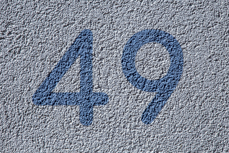 The house numbers forty nine  on the wall