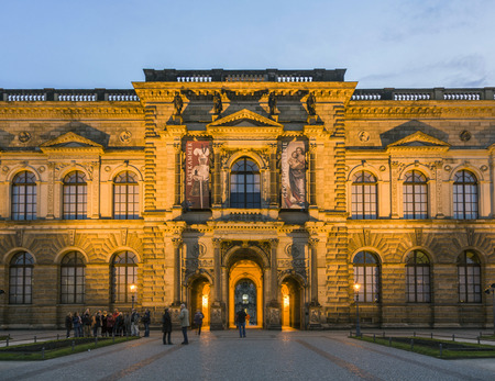 DRESDEN, GERMANY - SEPTEMBER 15, 2008:  people visit the outside facade of the Old Masters Picture Gallery in Zwinger by night. The Zwinger is a palace in Dresden.のeditorial素材