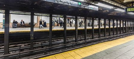 NEW YORK, USA - OCT 20, 2015: People wait at subway station Wall street in New York. With 1.75 billion annual ridership, NYC Subway is the 7th busiest metro system in the world.のeditorial素材
