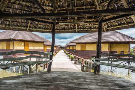 NYAUNGSHWE, MYANMAR - AUG 15, 2015: Shwe Inn Tha floating Hotel at the inle lake offers huts for tourists. The hotel opened in 1996 and is ISO certified (ISO 37).のeditorial素材