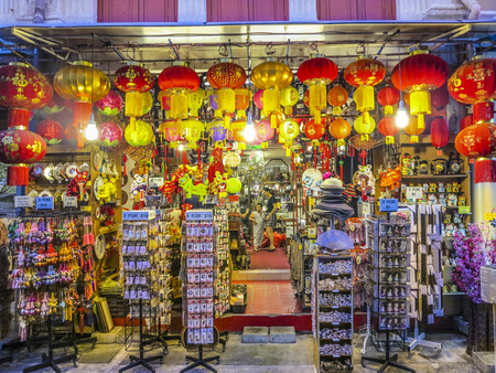 SINGAPORE, SINGAPORE - AUG 12, 2015: typical chinese shops are open tonight in Singapore. in 2014, 74 percent of the  Singapore population were chinese ethnic.のeditorial素材