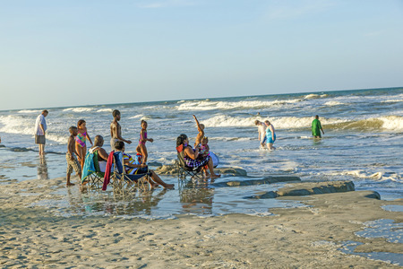 ST. AUGUSTINE, USA - JULY 23, 2010: people enjoy the beautiful beach in St. Augustine, USA. St. Augustine, Florida, was founded in 1565 and beside the historical sites famous for its beaches.のeditorial素材