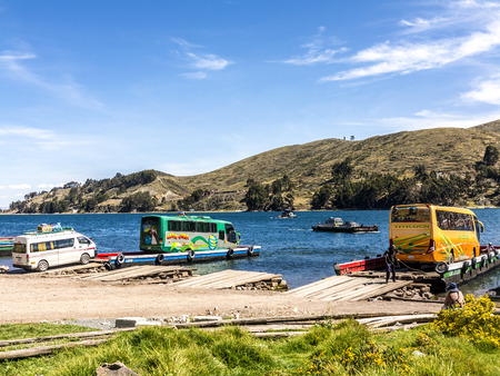 COPACABANA, BOLIVIA - NOV 13, 2015: Many tour boats and ferries in the harbor of the small tourist town of Copacabana in a bay of Lake Titicaca  in Copacabana, Bolivia.のeditorial素材