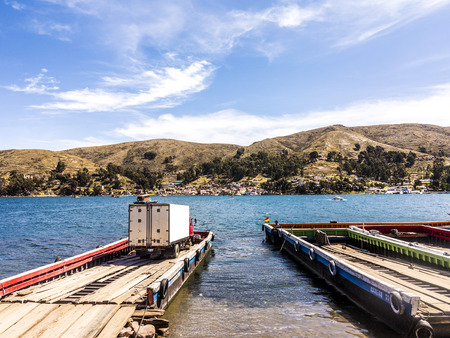 COPACABANA, BOLIVIA - NOV 13, 2015: Many tour boats and ferries in the harbor of the small tourist town of Copacabana in a bay of Lake Titicaca  in Copacabana, Bolivia.のeditorial素材